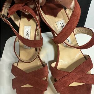 Jimmy Choo
Sandals platforms worm few times color burgundy whit gold